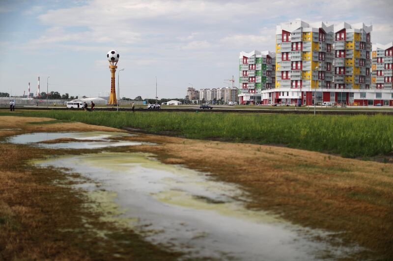 A football column is seen next to apartment buildings outside the World Cup stadium in Saransk, Russia. Lucy Nicholson / Reuters
