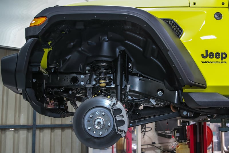 A Wrangler's front shock absorber and coil-spring set-up prior to an upgrade
