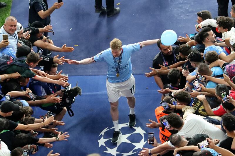 Manchester City's Kevin De Bruyne is greeted by fans as he leaves the pitch after the Champions League final soccer match where Manchester City beat Inter Milan 1-0 at the Ataturk Olympic Stadium in Istanbul, Turkey. AP