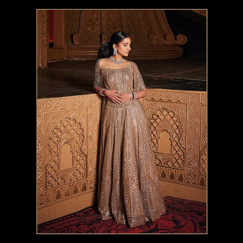 Bride-to-be Radhika Merchant wore a lehenga featuring a metal mesh drape embellished with more than 20,000 Swarovski crystals. The dress was made by more than 70 artisans, Malhotra said. Photo: @manishmalhotra05 / Instagram