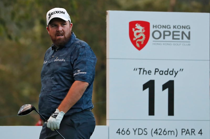 Shane Lowry of the United States watches his shot after tees off on the 11th hole during the Hong Kong Open golf tournament at Fanling Golf Club in Hong Kong, Thursday, Jan. 9, 2020. (AP Photo/Andy Wong)