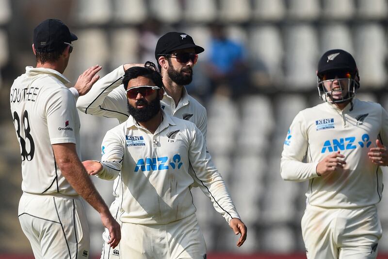 New Zealand spinner Ajaz Patel celebrates after taking the wicket of India's Mayank Agarwal. AFP