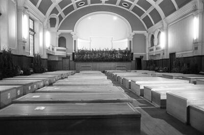 Almost 90 pine coffins of victims of the Pan Am Boeing 747 in Lockerbie's Town Hall. PA Images via Getty Images