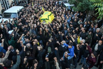 Mourners in Jbaa carry the coffin of a Hezbollah member who was killed in southern Lebanon in cross-border fire with Israeli troops. AFP