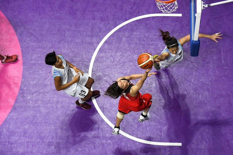 Japan's Mio Shinozaki lays the ball up against Thailand in their women's basketball game between during the 2018 Asian Games in Jakarta. AFP