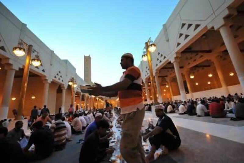 Foreign workers prepare to break their fast outside the Imam Turki bin Abdullah mosque in the Saudi capital Riyadh during Islam's holy month of Ramadan last year.