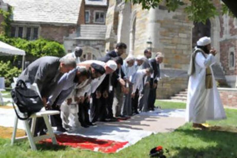 Sheikh al Habib Ali al Jifri, right, leads afternoon prayers in a courtyard at Yale University.