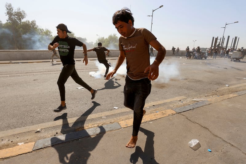 Fleeing from tear gas. Reuters
