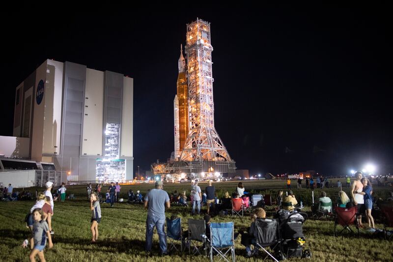Invited guests and Nasa employees watch as the Space Launch System rocket with the Orion spacecraft aboard is rolled out at Merrit Island, Florida. EPA 