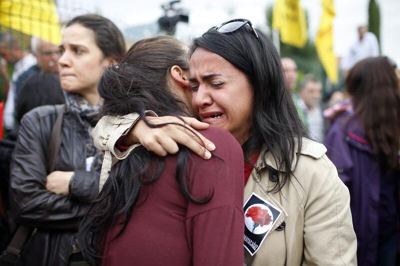 Mourners cry during the funeral of Uygar Coskun, 32, who was killed in Saturday's bombing attacks. Authorities investigating the twin suicide bombings at a rally promoting peace with the Kurdish were focusing on ISIL. Emrah Gurel/AP Photo