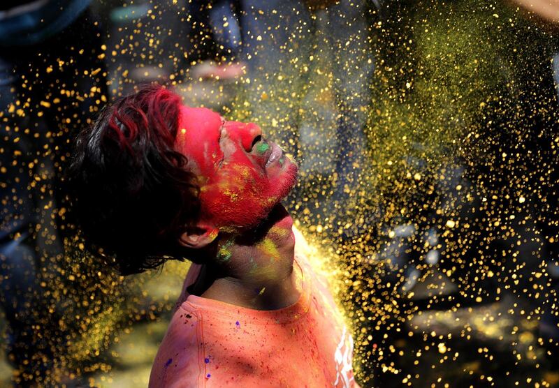 Locals apply coloured powder on each other during Holi festival celebrations in Kolkata, Eastern India, 09 March 2020. Holi is an ancient Indian festival also known as the 'Festival of Colour,' held to mark the arrival of spring. EPA