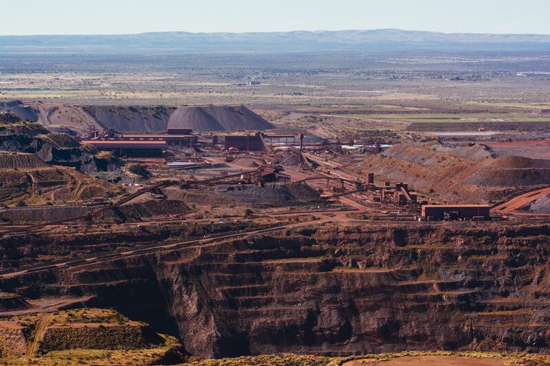 The iron ore excavation pit and processing plant stand at the Sishen open cast mine, operated by Kumba Iron Ore Ltd., an iron ore-producing unit of Anglo American Plc, in Sishen, South Africa, on Tuesday, May 22, 2018. Kumba Iron Ore may diversify into other minerals such as manganese and coal as Africa’s top miner of the raw material seeks opportunities for growth and to shield its business from price swings. Photographer: Waldo Swiegers/Bloomberg