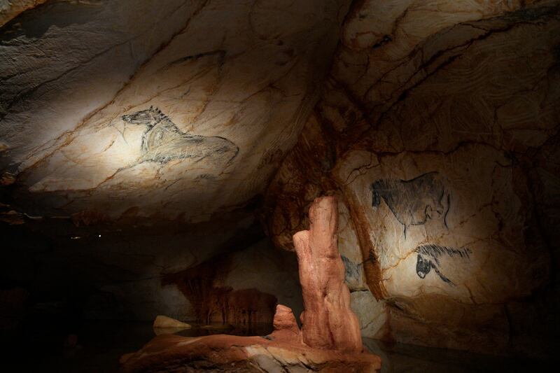 Reproductions of cave drawings are pictured in a replica of the Cosquer Cave in the Villa Mediterranee in Marseille, southern France, Thursday, June 2, 2022.  storic paintings that made the cave internationally famous.  The Cosquer Cave was discovered in 1985 by diver Henri Cosquer, nestled deep in the sea under the Marseille coastline.  (AP Photo / Daniel Cole)