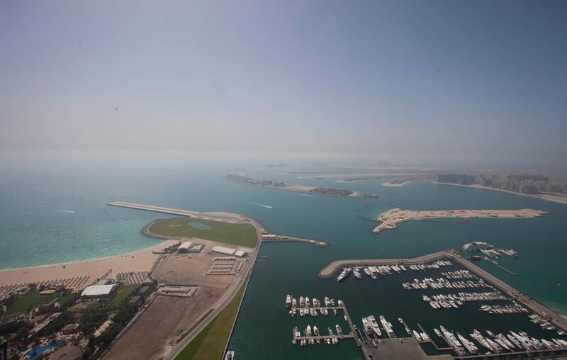 Dubai, United Arab Emirates - June 11 2013 - The Palm Jumeirah view from the 72nd floor penthouse apartment at the Cayan Tower in the Dubai Marina.  (Razan Alzayani / The National)