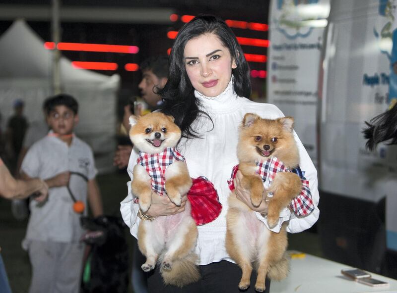 ABU DHABI, UNITED ARAB EMIRATES, 28 OCTOBER 2018 -A proud pet owner at the inaugural of Yas Pet Together event at Yas Du Arena, Abu Dhabi.  Leslie Pableo for The National for Evelyn Lau's story