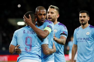 Fernandinho, centre, is training at home in Brazil with some help from his two children. Reuters