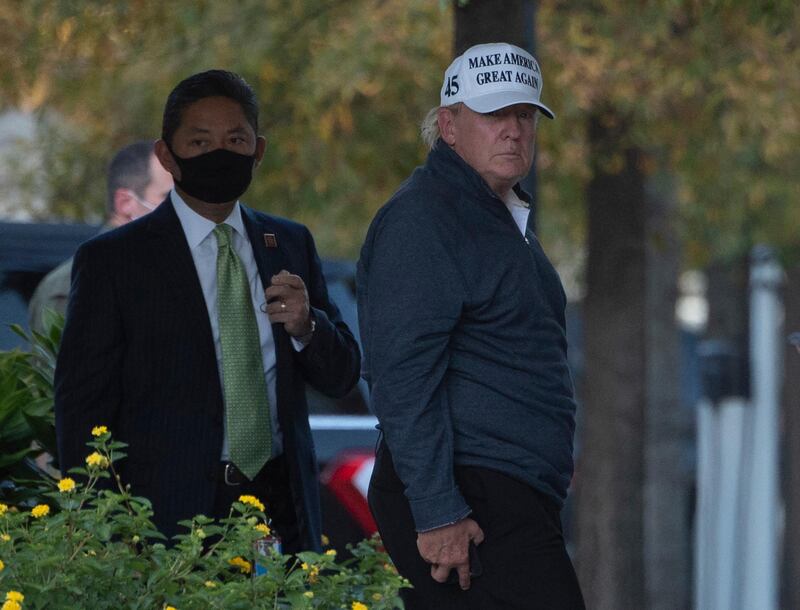 President Donald Trump returns to the White House from playing golf in Washington, DC on November 7, 2020, after Joe Biden was declared the winner of the 2020 presidential election. - Joyous celebrations erupted in Washington on Saturday after Joe Biden was declared winner of the US presidency, as several people poured into the streets of the US capital -- some of them chanting, cheering and singing in front of the White House. (Photo by ANDREW CABALLERO-REYNOLDS / AFP)