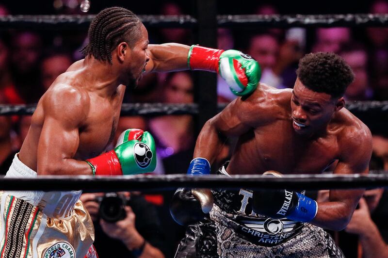 Errol Spence Jr avoids a punch from Shawn Porter. EPA