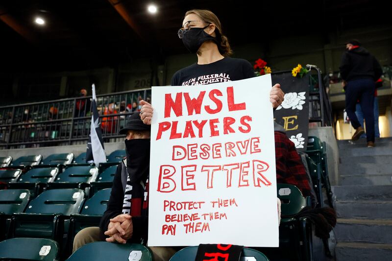 Portland Thorns fan holds a sign before a NWSL soccer match against Houston Dash at Providence Park. Reuters