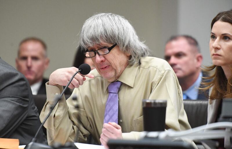 David Turpin, who pleaded guilty with his wife Louise to 14 felony counts for the abuse over several decades of their 13 children, addresses the court during their sentencing in Riverside, California on April 19, 2019. A California couple were jailed for at least 25 years on Friday, April 19, 2019 after admitting imprisoning and torturing 12 of their 13 children in a grisly "House of Horrors" case that shocked the world. David Allen Turpin, 57, and his wife Louise Anna Turpin, 50, had pleaded guilty to 14 felony counts -- including cruelty, false imprisonment, child abuse and torture of their children aged three to 30.  / AFP / POOL / WILL_LESTER
