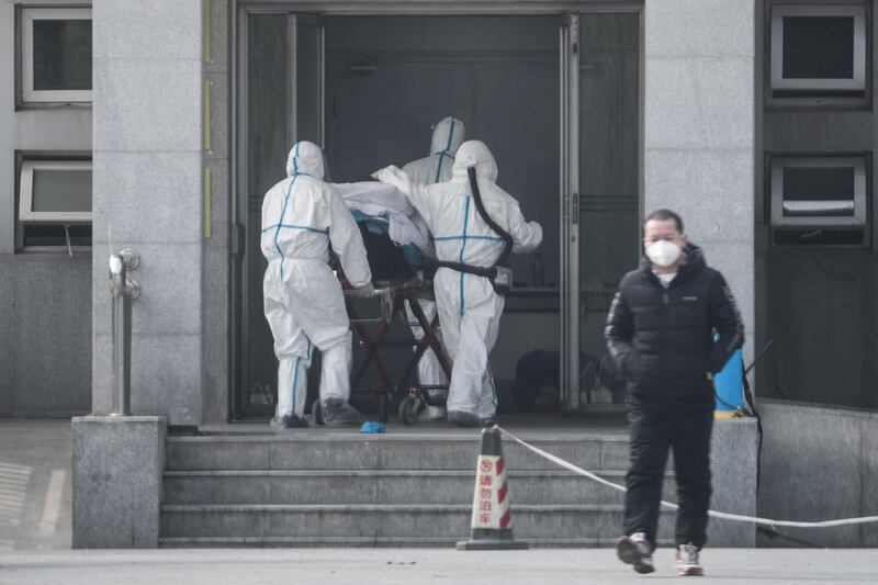 Medical staff carry a patient into the Jinyintan hospital, where patients infected with a new strain of Coronavirus identified as the cause of the Wuhan pneumonia outbreak are being treated, in Wuhan, China.  EPA