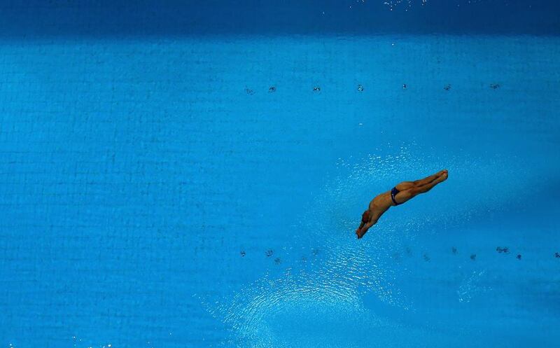 Tom Daley of Great Britain dives at the Fina Diving World Series 2014 at the Hamdan Sports Complex. Warren Little / Getty Images 