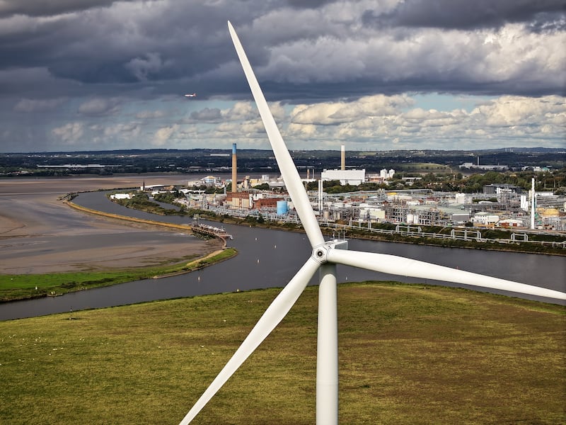 Wind turbines in Runcorn, England. Clean energy investment must grow from $1.8 trillion in 2023 to $4.5 trillion annually by the early 2030s, the IEA said. Getty Images