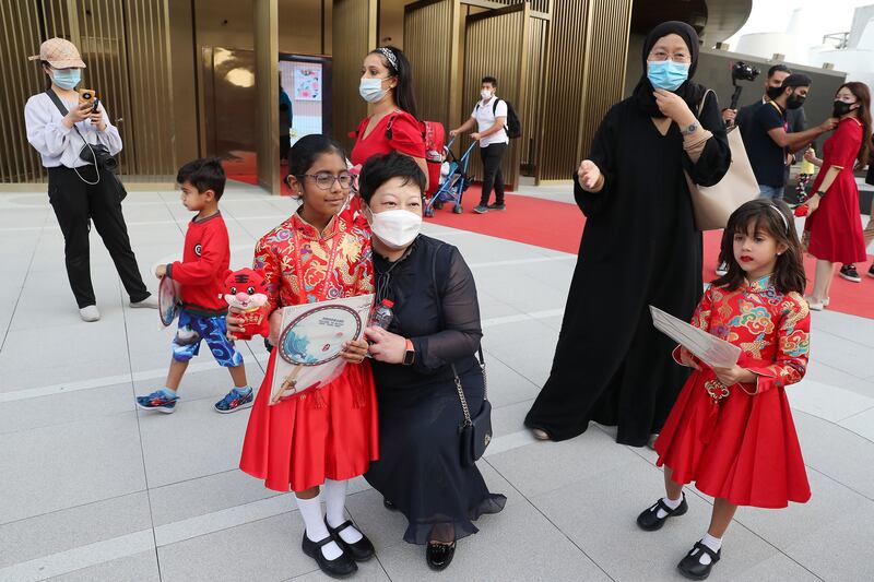 Dr Liu Yanhui with the young stars of the Lunar New Year show. Pawan Singh / The National