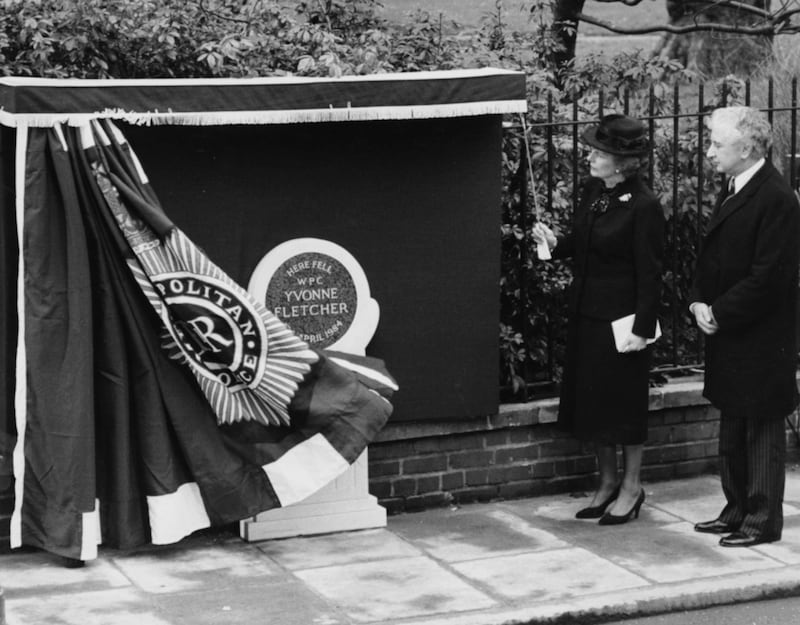 British Prime Minister Margaret Thatcher unveils a memorial stone honouring Ms Fletcher in St James's Square in 1985