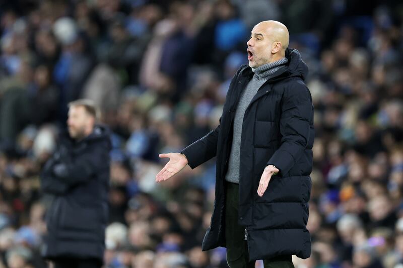 Pep Guardiola, manager of Manchester City, reacts during the match. Getty