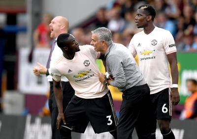 BURNLEY, ENGLAND - SEPTEMBER 02:  Jose Mourinho, Manager of Manchester United in discussion with Eric Bailly of Manchester United as he replaces Paul Pogba of Manchester United during the Premier League match between Burnley FC and Manchester United at Turf Moor on September 2, 2018 in Burnley, United Kingdom.  (Photo by Shaun Botterill/Getty Images)