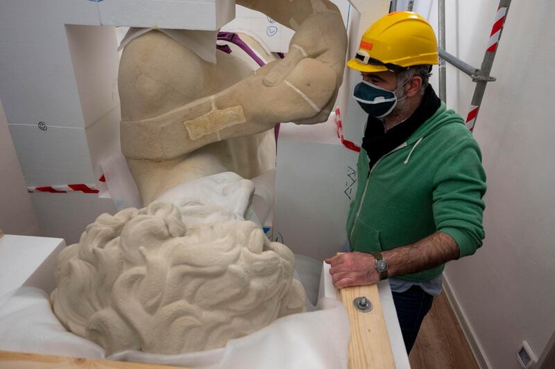 Engineers in Florence used high-tech cameras and mounted laser scanners on stairs to capture microscopic details of the 16th-century marble statue. EPA