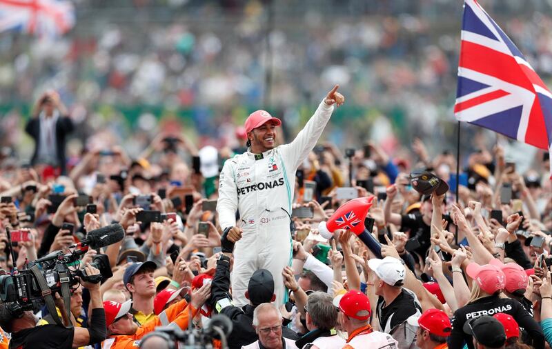 Lewis Hamilton celebrates at Silverstone after winning the British GP last season. Reuters