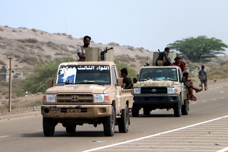 epa06768605 Yemeni government forces backed by the Saudi-led coalition take position at an area after seizing it from the Houthi militia in the western province of Hodeidah, Yemen, 27 May 2018 (issued 28 May 2018). According to reports, Yemeni troops backed by the Saudi-led coalition have moved closer to a key Houthis-held port and strategic city of Hodeidah after Yemeni government forces seized Houthis-held areas along the western coast. Most of Yemen's food and medicine imports and aid are shipped through Hodeidah port.  EPA/STRINGER