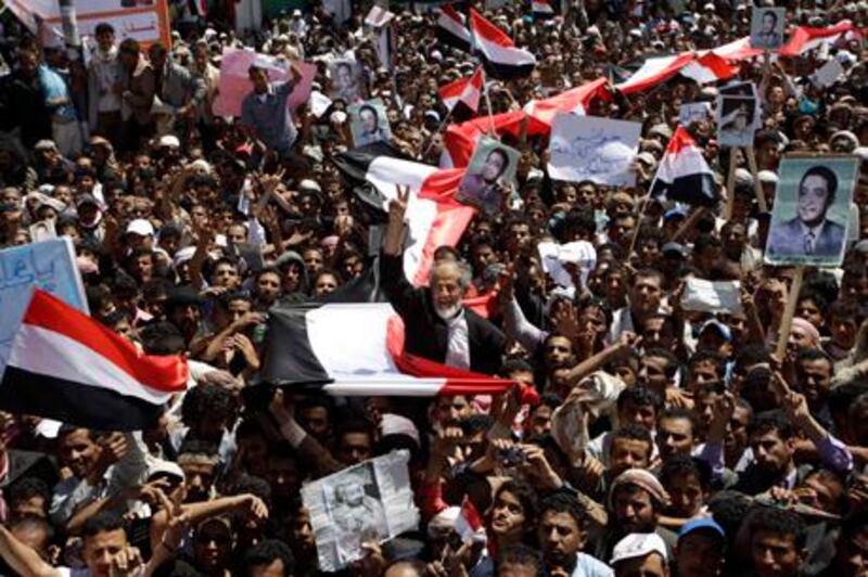 Anti-government protesters shout slogans during a protest demanding the ouster of Yemen's President Ali Abdullah Saleh outside Sanaa University March 1, 2011. Tens of thousands of protesters flooded Yemen's streets on Tuesday, dedicating a fresh "Day of Rage" to the 24 people killed in demonstrations demanding an end to the Saleh's three-decade rule.  REUTERS/Ammar Awad (YEMEN - Tags: POLITICS CIVIL UNREST)