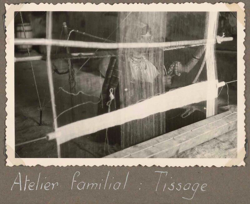 Vers la Tunisie...Sur le Kairouan (A Trip to Tunisia on the Kairouan). A woman weaves on a loom in Matmata, Tunisia, circa 1951