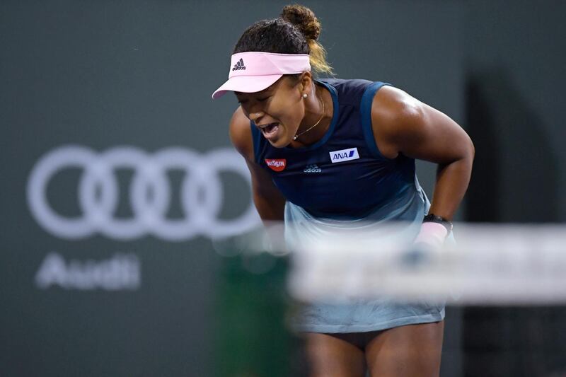 Naomi Osaka celebrates winning a point. AP Photo