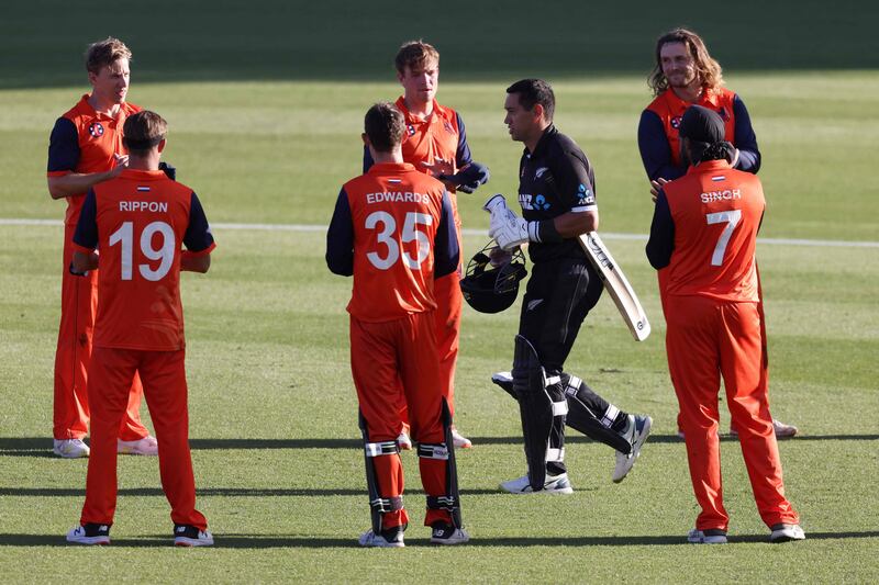 New Zealand’s Ross Taylor is applauded by Dutch players in Hamilton on Monday. AFP