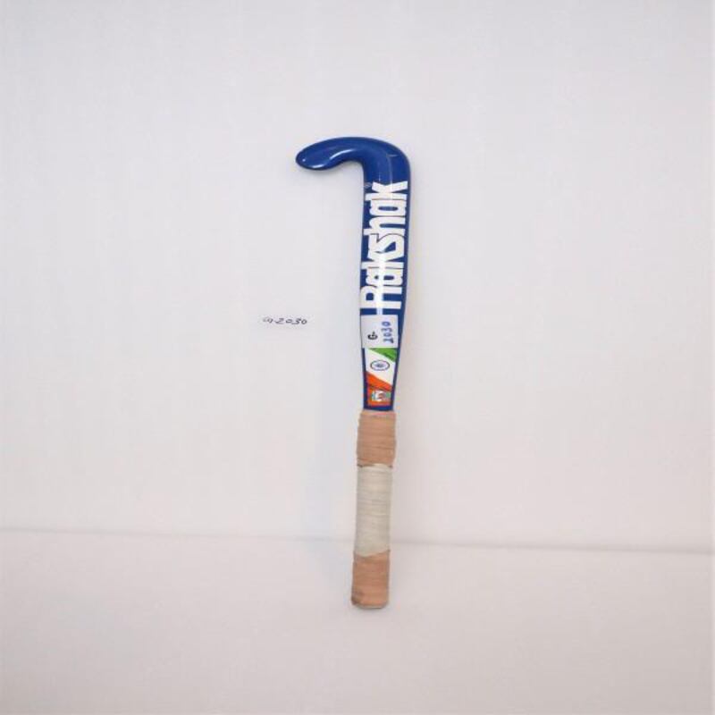 A blue coloured hockey stick includes a logo named Rakshak written in white, and the model number is Rani 28, which directly points to Rani Rampal, the captain of the Women Hockey Team of India and 28 is her jersey number. Courtesy PM Mementos