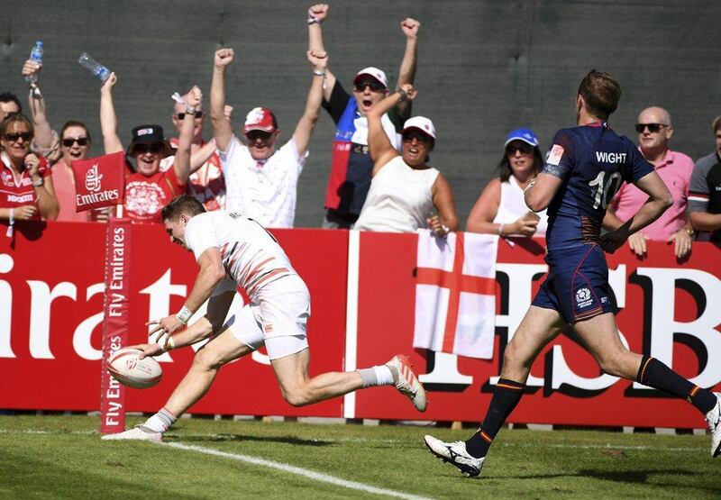 England's fans cheer Ruaridh McConnochie's try against Scotland to give his team 24-21 last minute turnaround win in their quarter-final. Martin Dokoupil / AP Photo / December 3, 2016