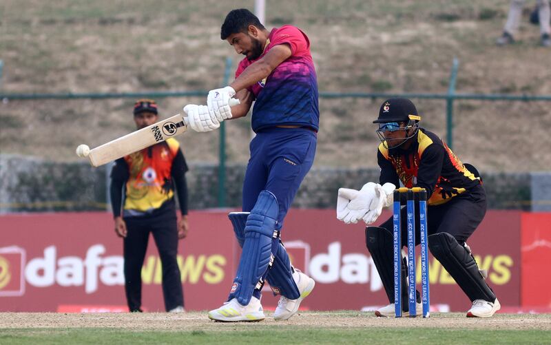 UAE's Junaid Khan plays a shot against PNG