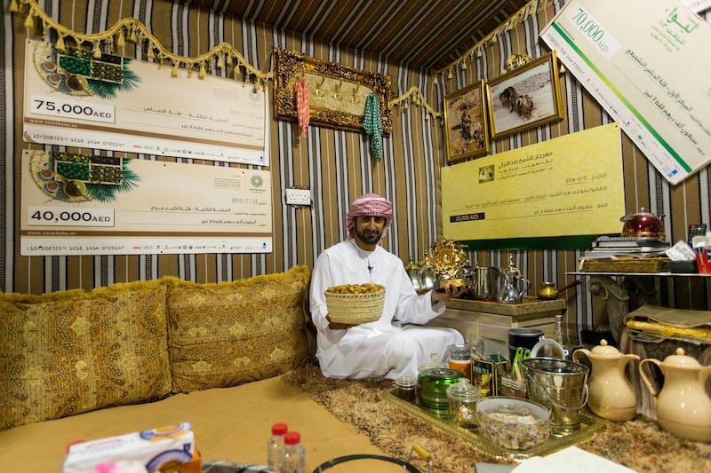 Liwa, United Arab Emirates, July 20, 2017:    Rashed Abdullah, winner of the largest date branch for the Liwa Date Festival in the majalis at his farm in the Al Dhafra Region of Abu Dhabi on July 20, 2017. The festival runs from July 19th to 29th. The winning branch weighed in at 106.5kg. Christopher Pike / The NationalReporter: Anna ZachariasSection: News