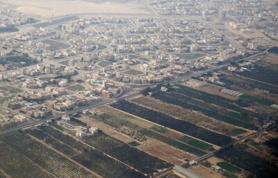 An aerial view of new housing complexes in a suburb of Cairo is pictured through the window of a plane, Egypt December 16, 2017. Picture taken December 16, 2017. REUTERS/Amr Abdallah Dalsh