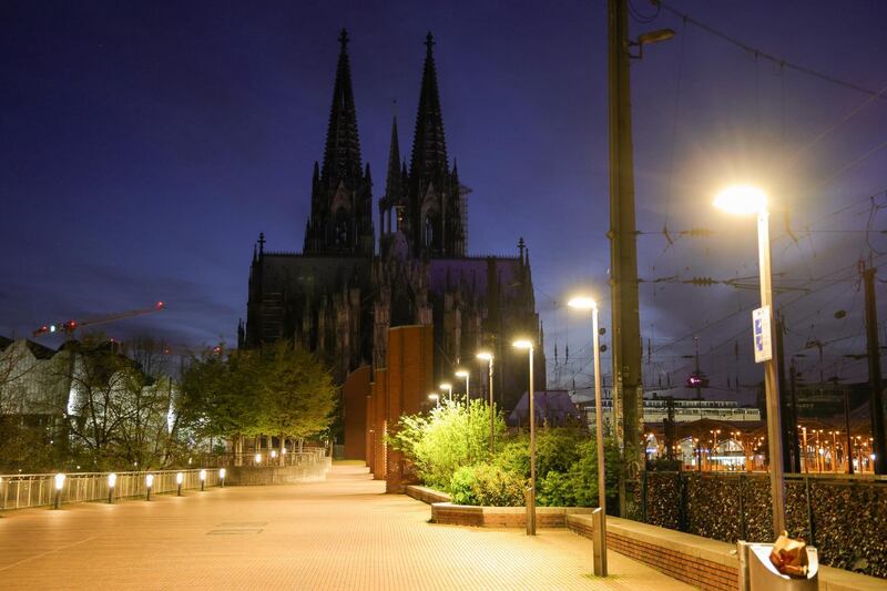A deserted road near the Cologne Cathedral during the nightly curfew in Cologne, Germany. Getty Images