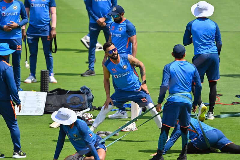 India’s Virat Kohli, centre, warms up during training ahead of the fourth Test against Australia at Narendra Modi Stadium in Ahmedabad, on March 7, 2023. AFP