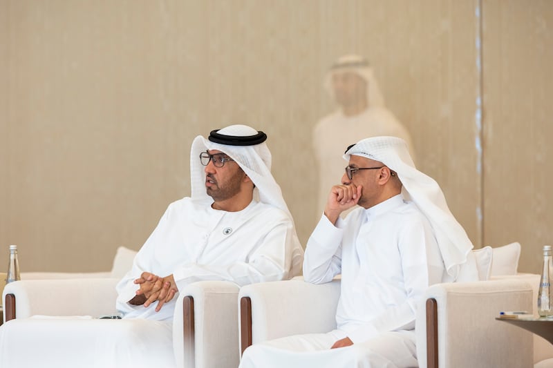 Dr Sultan Al Jaber, Minister of Industry and Advanced Technology and managing director and group chief executive of Adnoc, and Jassim Al Zaabi, chairman of the Abu Dhabi Department of Finance, at the Presidential Airport. Photo: Ryan Carter / UAE Presidential Court 