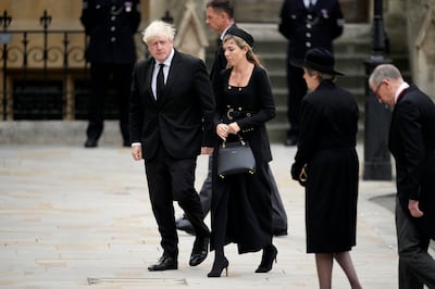 Former UK prime minister Boris Johnson and Carrie Johnson arrive at Westminster Abbey for the state funeral of Queen Elizabeth II. Getty Images 