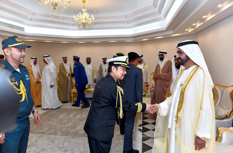 Sheikh Mohammed bin Rashid, Vice President, Ruler of Dubai and Minister of Defence, is greeted by officials at the Khalifa bin Zayed Air College in Al Ain on Monday. Wam