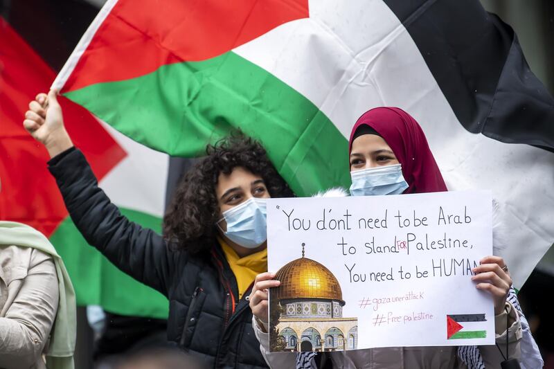 Protesters in Geneva, Switzerland, show messages of solidarity with Palestinians in their conflict with Israel. EPA