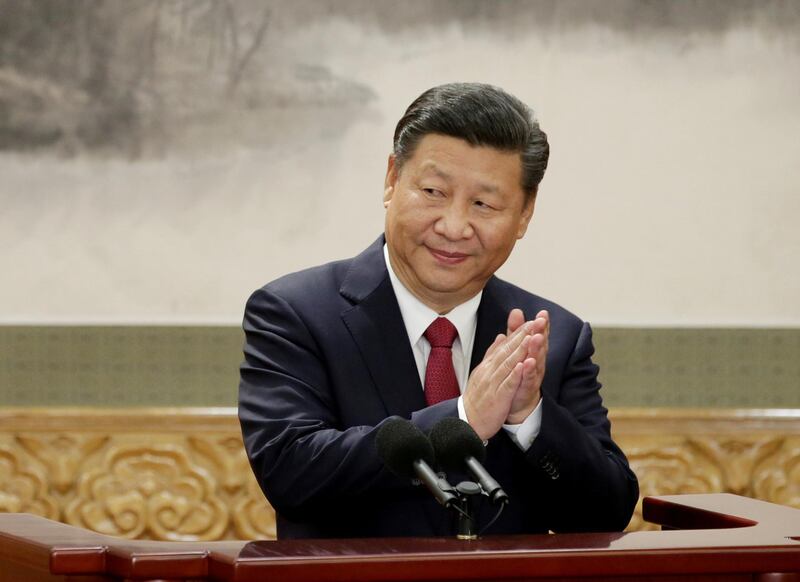 FILE PHOTO: China's President Xi Jinping claps after his speech as he and other new Politburo Standing Committee members meet with the press at the Great Hall of the People in Beijing, China October 25, 2017.  To match Special Report CHINA-RISK/SHADOW BANKING     REUTERS/Jason Lee/File Photo